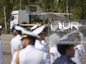 A truck is carrying an Iranian-made Unmanned Aerial Vehicle (UAV) during a military parade marking Iran's Army Day anniversary at an Army mi...