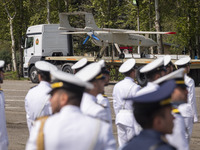 A truck is carrying an Iranian-made Unmanned Aerial Vehicle (UAV) during a military parade marking Iran's Army Day anniversary at an Army mi...