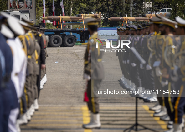 A truck is carrying Iranian-made Unmanned Aerial Vehicles (UAVs) during a military parade marking the anniversary of Iran's Army Day at an A...