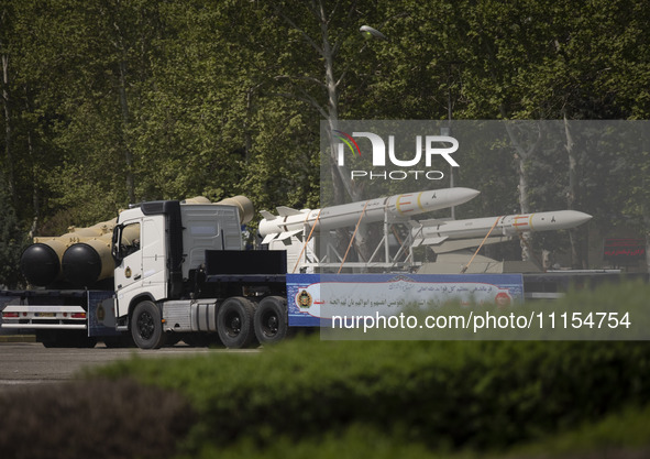 A truck is carrying Iranian-made Sayyad-4B missiles during a military parade marking the anniversary of Iran's Army Day at an Army military...