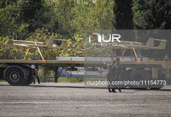 A truck is carrying Iranian-made Unmanned Aerial Vehicles (UAVs) during a military parade marking the anniversary of Iran's Army Day at an A...