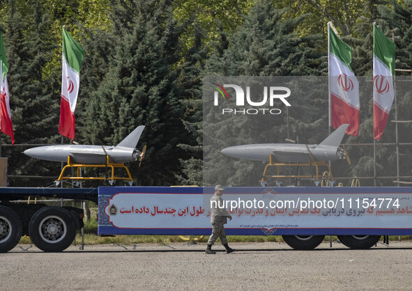 A truck is carrying Iranian-made Unmanned Aerial Vehicles (UAVs) during a military parade marking the anniversary of Iran's Army Day at an A...