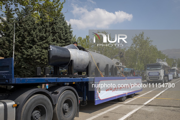 A truck is carrying an Iranian-made suicide submarine during a military parade marking Iran's Army Day anniversary at an Army military base...