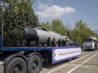 A truck is carrying an Iranian-made suicide submarine during a military parade marking Iran's Army Day anniversary at an Army military base...