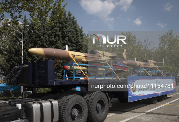 A truck is carrying Iranian-made Unmanned Aerial Vehicles (UAVs) during a military parade marking the anniversary of Iran's Army Day at an A...