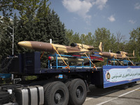 A truck is carrying Iranian-made Unmanned Aerial Vehicles (UAVs) during a military parade marking the anniversary of Iran's Army Day at an A...