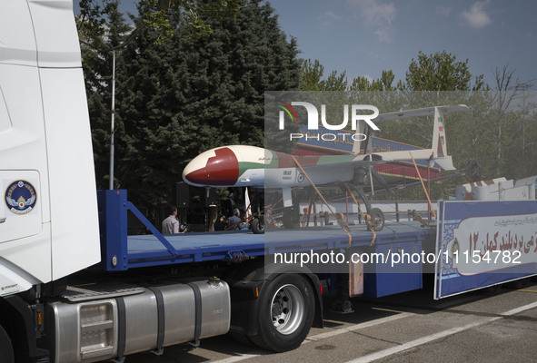 An Iranian-made Kaman-12 Unmanned Aerial Vehicle (UAV) is being carried by a truck during a military parade marking Iran's Army Day annivers...