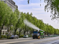 A fog cannon truck is carrying out spraying operations on Jiangjunshan Road in Qingzhou, China, on April 17, 2024. Every April and May is th...