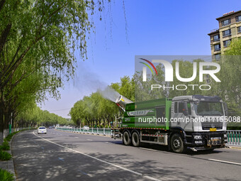 A fog cannon truck is carrying out spraying operations on Jiangjunshan Road in Qingzhou, China, on April 17, 2024. Every April and May is th...