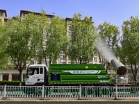 A fog cannon truck is carrying out spraying operations on Jiangjunshan Road in Qingzhou, China, on April 17, 2024. Every April and May is th...