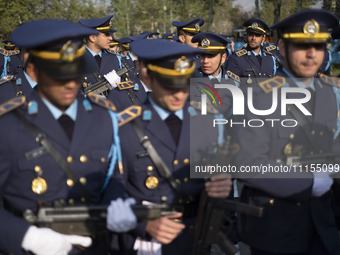 Members of the Iranian Army's air force are preparing to march in a military parade marking the anniversary of Iran's Army Day at an Army mi...