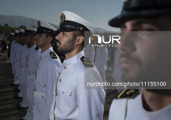 Members of the Iranian navy are standing at attention during a military parade marking the anniversary of Iran's Army Day at an Army militar...