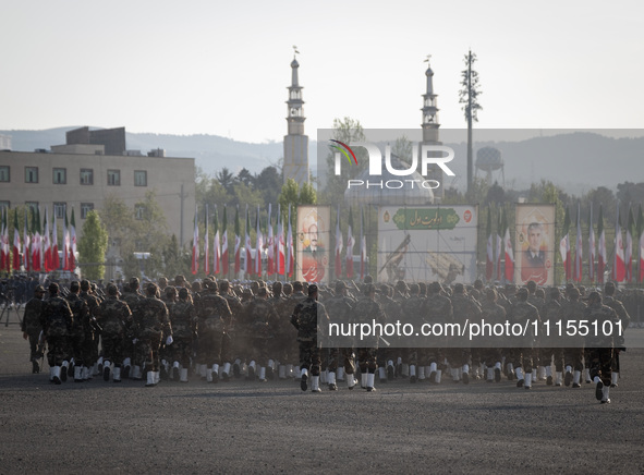 Members of the Iranian Army's land force are preparing to march in a military parade marking Iran's Army Day anniversary at an Army military...