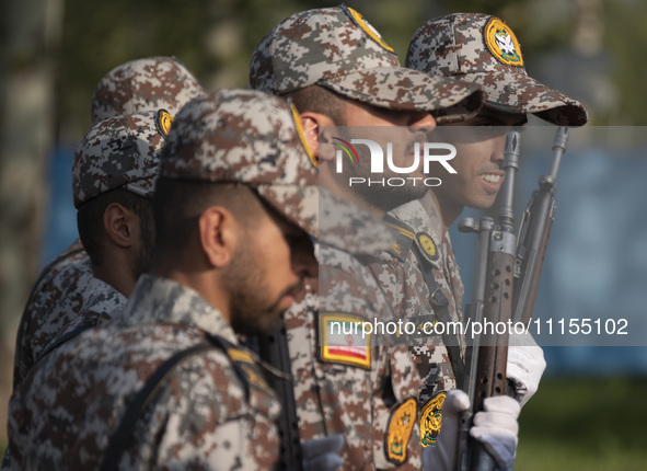 Members of the Iranian Army's land force are preparing to march in a military parade marking Iran's Army Day anniversary at an Army military...