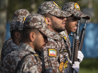 Members of the Iranian Army's land force are preparing to march in a military parade marking Iran's Army Day anniversary at an Army military...