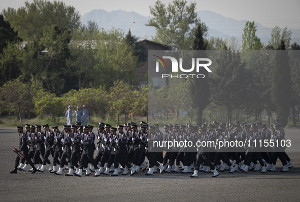 Members of the Iranian navy are preparing to march in a military parade marking the anniversary of Iran's Army Day at an Army military base...