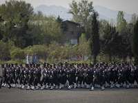 Members of the Iranian navy are preparing to march in a military parade marking the anniversary of Iran's Army Day at an Army military base...