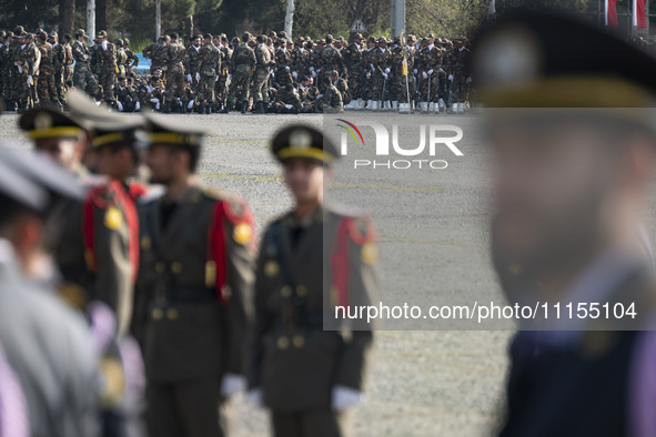 Members of the Iranian Army's land force are preparing to march in a military parade marking Iran's Army Day anniversary at an Army military...