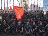 Members of the Basij paramilitary force are posing for a photograph as they prepare to march in a military parade marking Iran's Army Day an...