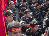 Members of the Basij paramilitary force are preparing to march in a military parade marking the anniversary of Iran's Army Day at an Army mi...