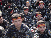 Iranian schoolboys, who are also members of the Basij paramilitary force, are preparing to march in a military parade marking Iran's Army Da...