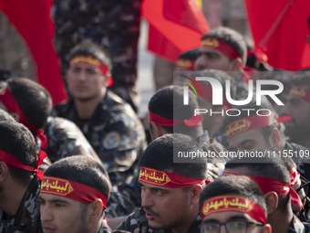 Members of the Basij paramilitary force are preparing to march in a military parade marking the anniversary of Iran's Army Day at an Army mi...