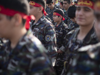 Iranian schoolboys, who are also members of the Basij paramilitary force, are preparing to march in a military parade marking Iran's Army Da...