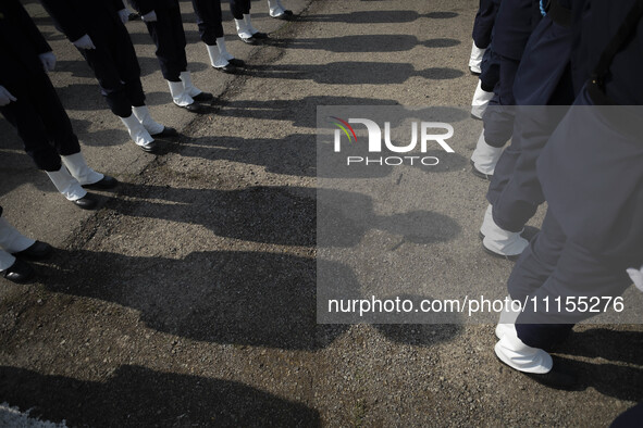 Members of an Iranian Army's music band are standing at attention during a military parade marking Iran's Army Day anniversary at an Army mi...