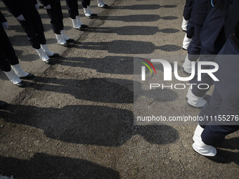 Members of an Iranian Army's music band are standing at attention during a military parade marking Iran's Army Day anniversary at an Army mi...