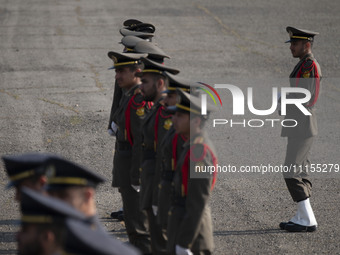 Members of the Iranian Army's honor guard are standing at attention during a military parade marking the anniversary of Iran's Army Day at a...