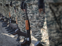 Members of the Iranian Army's land force are standing at attention during a military parade marking the anniversary of Iran's Army Day at an...