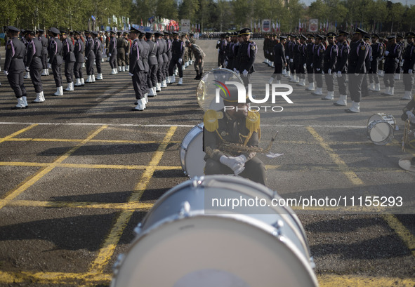 A member of the Iranian Army's music band is waiting to perform in a military parade marking Iran's Army Day anniversary at an Army military...