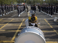 A member of the Iranian Army's music band is waiting to perform in a military parade marking Iran's Army Day anniversary at an Army military...