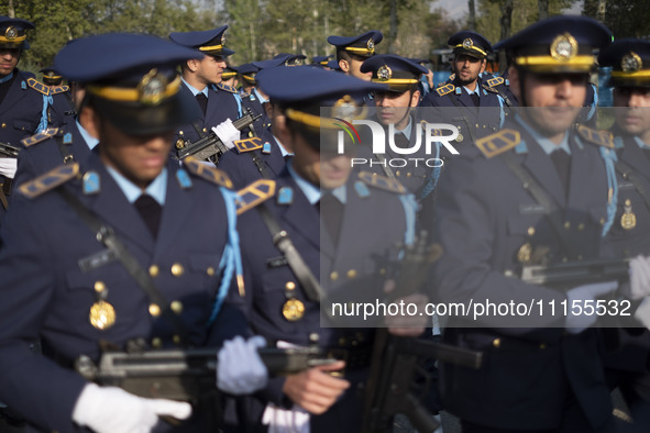 Members of the Iranian Army's air force are preparing to march in a military parade marking the anniversary of Iran's Army Day at an Army mi...