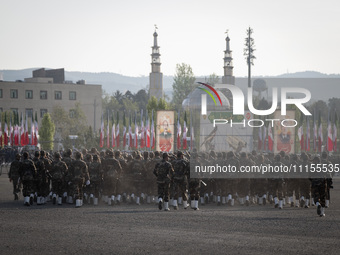 Members of the Iranian Army's land force are preparing to march in a military parade marking Iran's Army Day anniversary at an Army military...