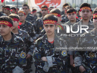 Iranian schoolboys, who are also members of the Basij paramilitary force, are preparing to march in a military parade marking Iran's Army Da...