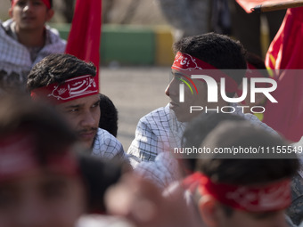 Members of the Basij paramilitary force are preparing to march in a military parade marking Iran's Army Day anniversary at an Army military...