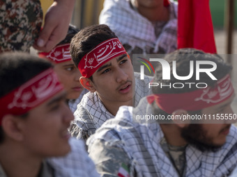 Members of the Basij paramilitary force are preparing to march in a military parade marking Iran's Army Day anniversary at an Army military...