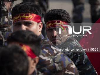 Members of the Basij paramilitary force are preparing to march in a military parade marking Iran's Army Day anniversary at an Army military...