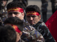 Members of the Basij paramilitary force are preparing to march in a military parade marking Iran's Army Day anniversary at an Army military...