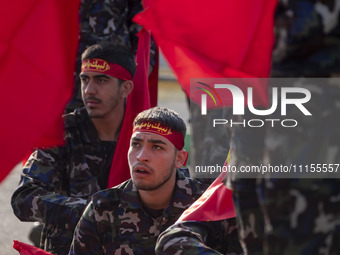 Members of the Basij paramilitary force are preparing to march in a military parade marking Iran's Army Day anniversary at an Army military...