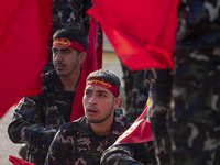 Members of the Basij paramilitary force are preparing to march in a military parade marking Iran's Army Day anniversary at an Army military...