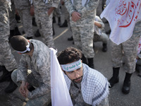 Members of the Basij paramilitary force are preparing to march in a military parade marking Iran's Army Day anniversary at an Army military...