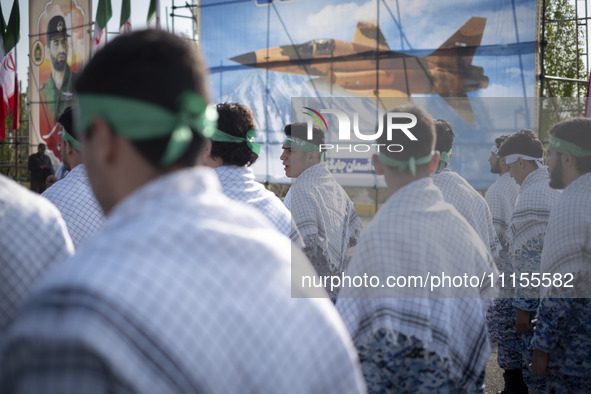 Members of the Basij paramilitary force are preparing to march in a military parade marking Iran's Army Day anniversary at an Army military...