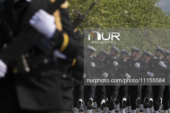 Members of the Iranian navy are marching in a military parade to mark the anniversary of Iran's Army Day at an Army military base in Tehran,...