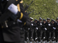 Members of the Iranian navy are marching in a military parade to mark the anniversary of Iran's Army Day at an Army military base in Tehran,...