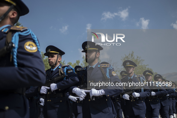 Members of the Iranian Army's air force are marching in a military parade to mark the anniversary of Iran's Army Day at an Army military bas...