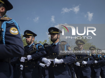 Members of the Iranian Army's air force are marching in a military parade to mark the anniversary of Iran's Army Day at an Army military bas...