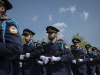 Members of the Iranian Army's air force are marching in a military parade to mark the anniversary of Iran's Army Day at an Army military bas...