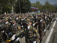 Members of the Iranian Army's land force are marching in a military parade to mark the anniversary of Iran's Army Day at an Army military ba...